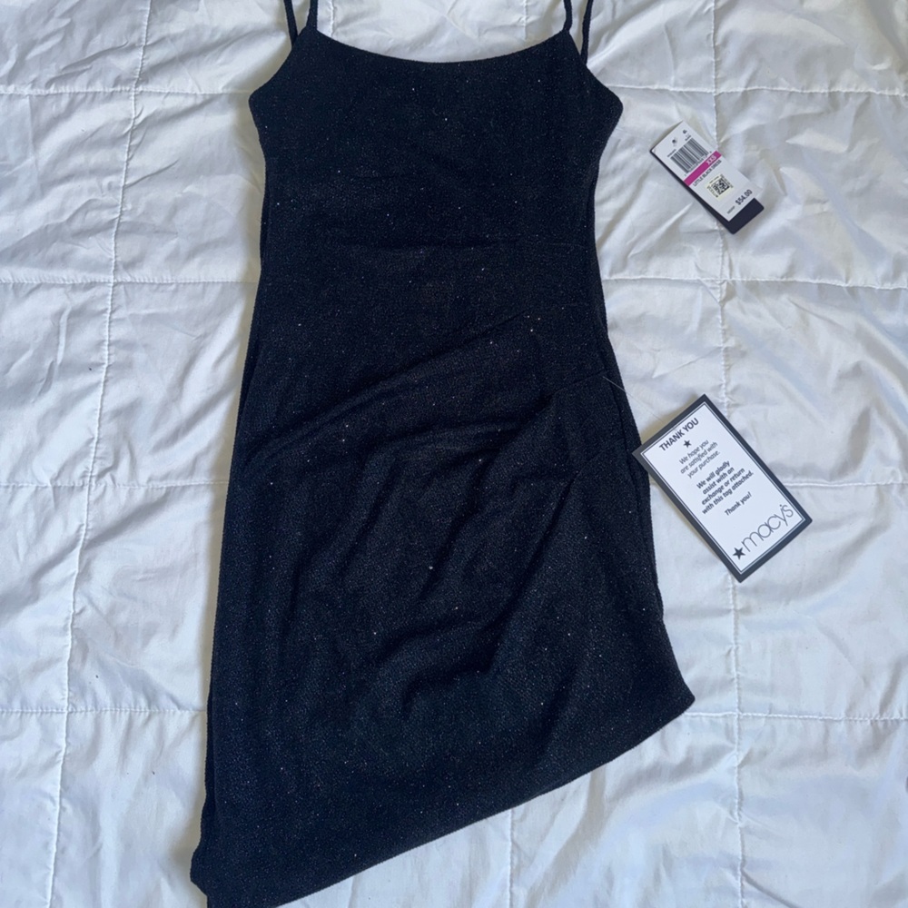 Macys short, slanted, sparkly black dress.